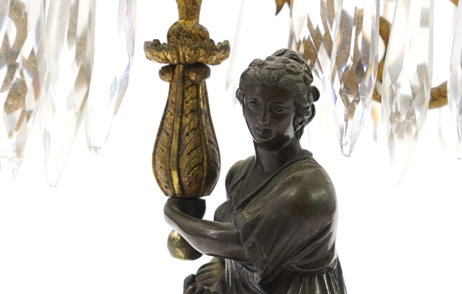 After Mathurin Moreau. A pair of mid 19th century bronze and gilt bronze two branch candelabra